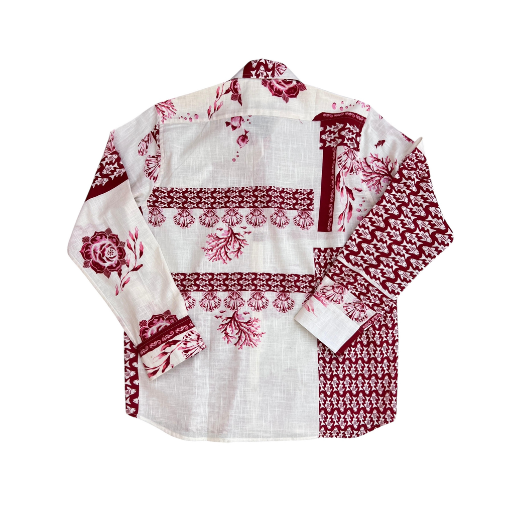 White shirt with red floral patterns on a white background