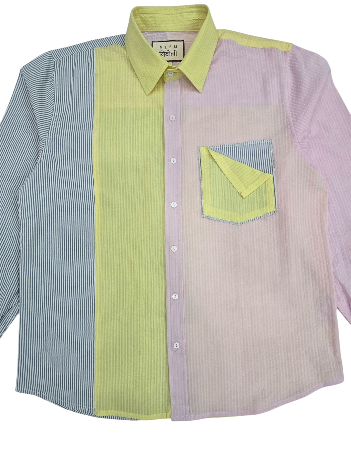 Long-sleeve shirt with green and purple color block design on a white background