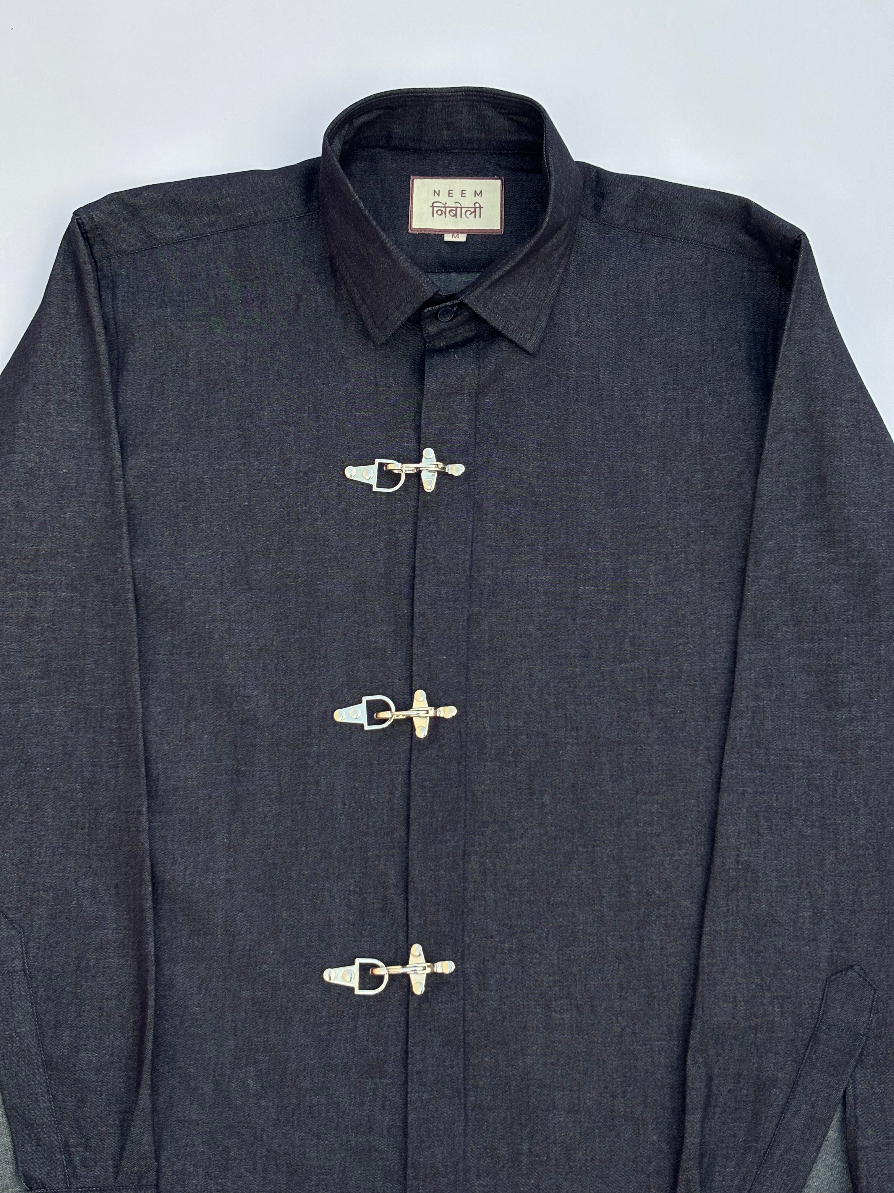 Dark blue jacket with silver buttons on a light gray background
