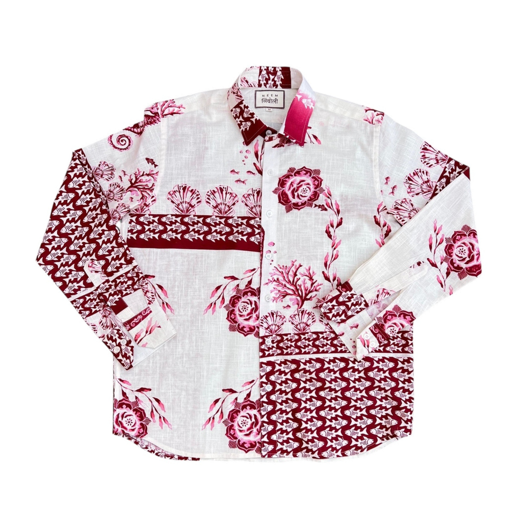 Floral patterned shirt with red and pink design on a white background