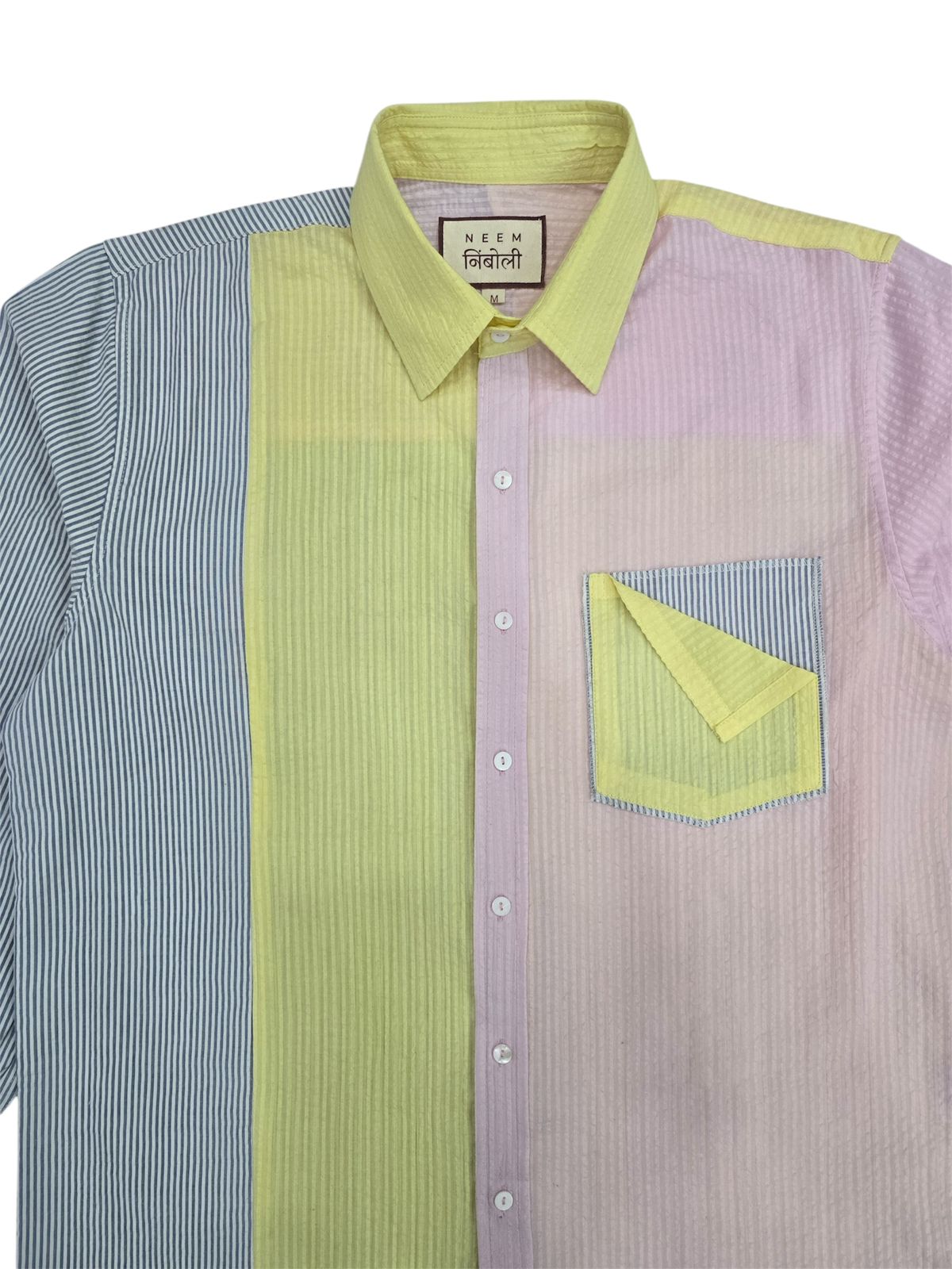 Shirt with green and purple pattern on a white background